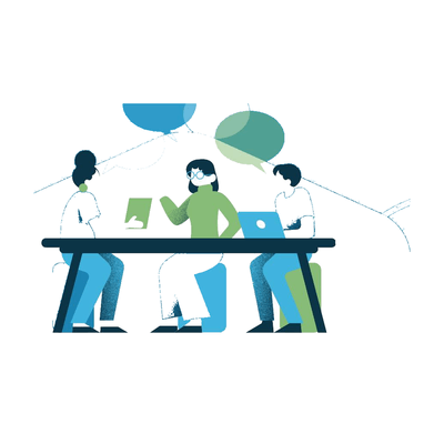 Three people working together at a shared desk