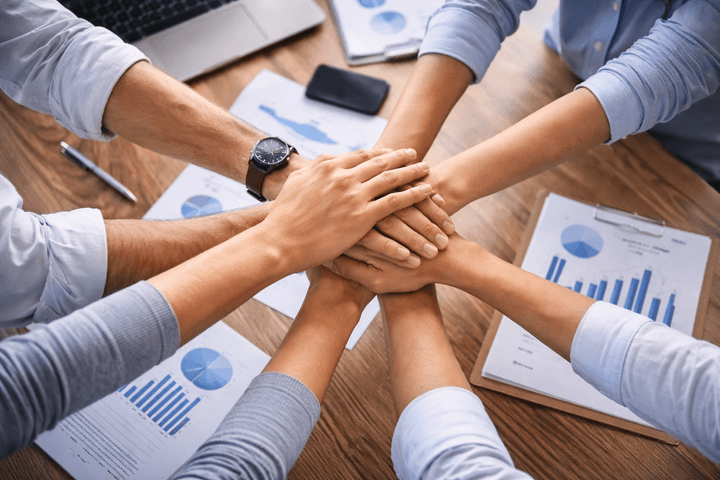 many hands holding together