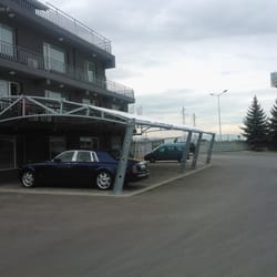 Side view of the textile canopy at Sanitex parking zone, captured from a distance.