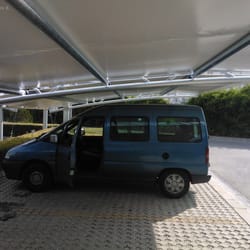 Side view from beneath the membrane canopy installed at Dominov Konsumativ’s parking area in Plovdiv.