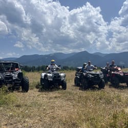four atv in the front of beautiful view